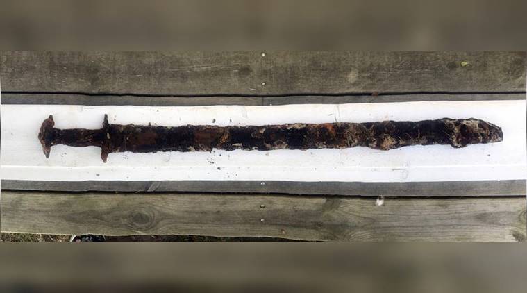 In Sweden, eight-year-old girl pulls pre-viking sword from lake