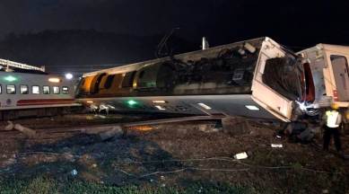 In this photo released by Taiwan Railways Administration, train carriages are scattered at the site of a train derailment in Lian in northern Taiwan on Sunday, Oct. 21, 2018. The Puyuma express train was carrying more than 300 passengers toward Taitung, a city on Taiwan's southeast coast, when it went off the tracks on Sunday afternoon. (Taiwan Railways Administration via AP)