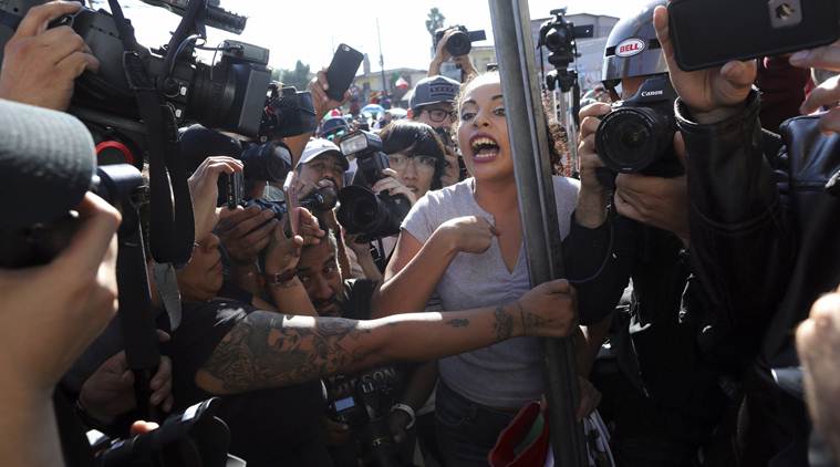 US fires tear gas into Mexico to repel migrants, closes border gate for several hours