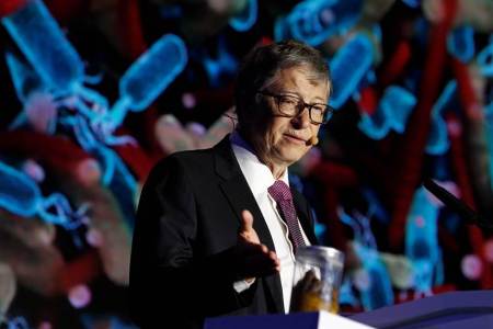 Bill Gates gives a speech with a jar of faeces next to him on the future of toilets