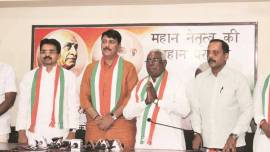 Sundersinh Chauhan joins Congress, Sundersinh Chauhan quits BJP, BJP minister joins Congress, Lok Sabha elections, anti-farmer policies, Indian Express 