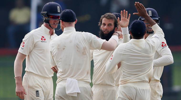Moeen Ali celebrates with his teammates