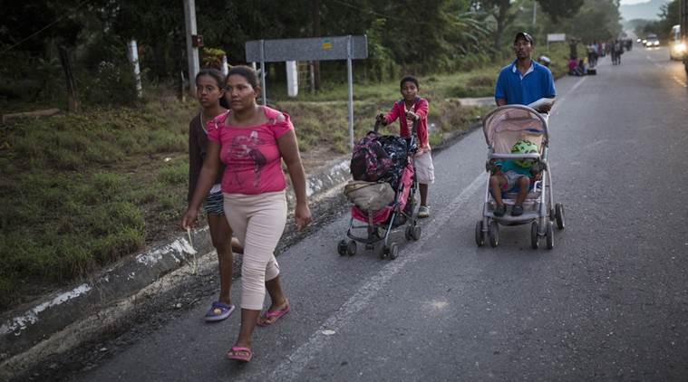 The Espinar family walks on the road that connects Pijijiapan with Arriaga, Mexico.