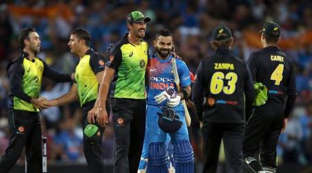 India's Virat Kohli is embraced by Australia's Mitchell Starc after their Twenty20 cricket match in Sydney