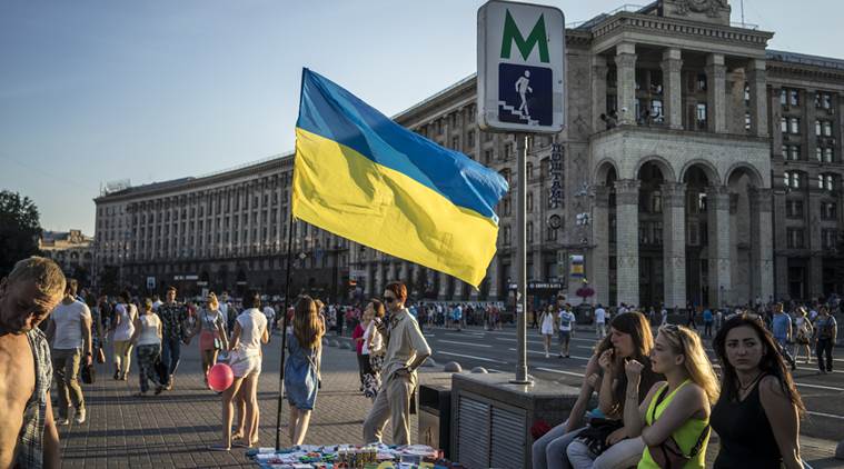 A Ukranian flag flies in downtown Kiev