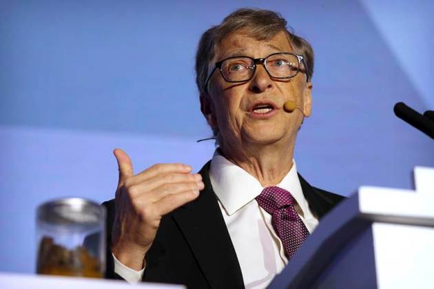 Bill Gates gives a speech with a jar of faeces next to him on the future of toilets