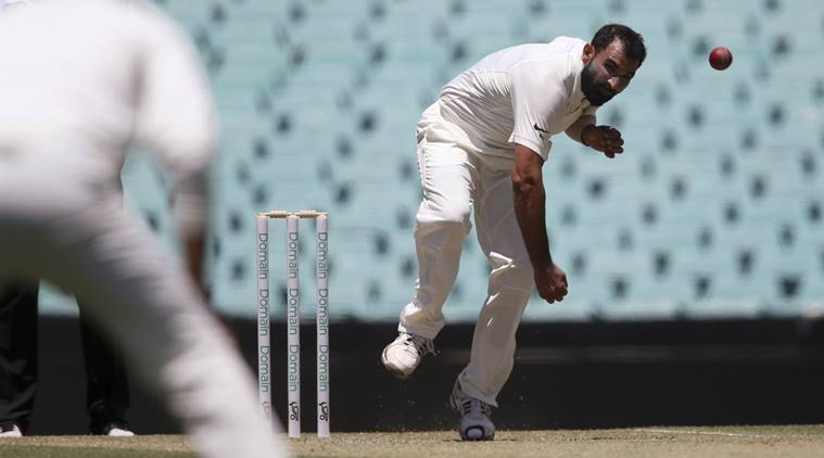 Mohammed Shami, right, bowls a ball that will take a wicket during their tour cricket match against Cricket Australia XI in Sydney