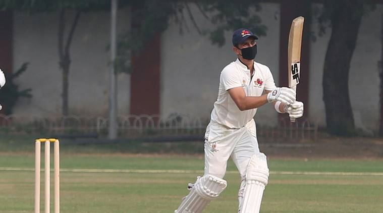 Siddhesh Lad plays with a facemask in the Ranji Trophy