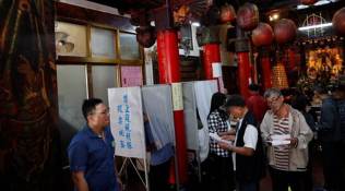 Taiwan votes in test for pro-independence ruling party as China watches