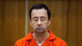 Larry Nassar listens during his sentencing at Eaton County Circuit Court in Charlotte, Michigan.