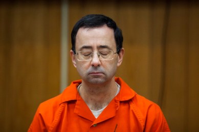 Larry Nassar listens during his sentencing at Eaton County Circuit Court in Charlotte, Michigan.