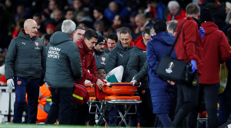 Arsenal's Danny Welbeck leaves the pitch on a stretcher after sustaining an injury