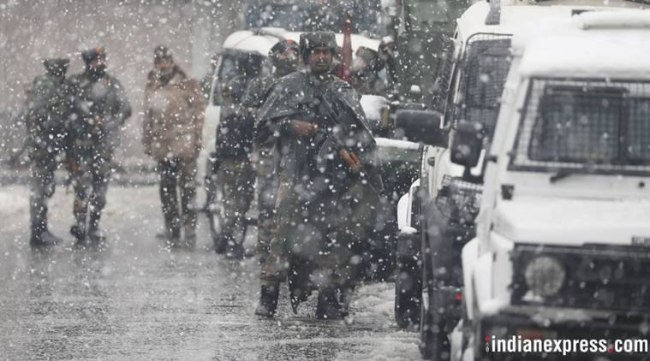 Paramilitary force soldiers guard the cordoned off area in Srinagar. CRPF sources said it took a long time to kill the militants, even though they were holed up in an under-construction building, because there are many residential units in the congested neighbourhood. (Express Photo/Shuaib Masoodi)