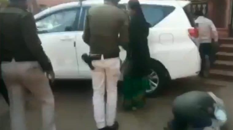 A farmer (far right) falls down crying in front of District Collector, shivpuri