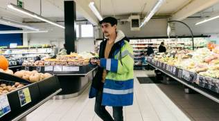 A protester, Florian Dou, goes grocery shopping