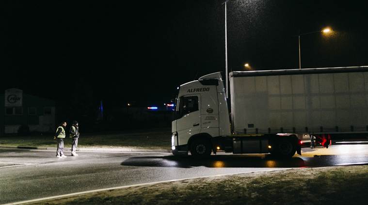 Yellow Vest protesters stop a truck at a roundabout in Guéret, France.