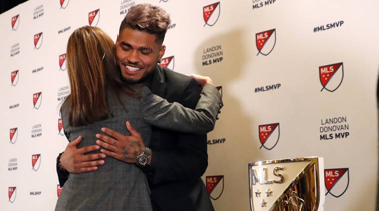 Atlanta United soccer player Josef Martinez is embraced by Angie Blank wife of team owner Arthur Blank after it was announced he had won the Landon Donovan MLS MVP award