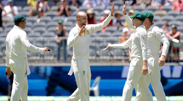 Australia's Nathan Lyon (2nd L) is congratulated by his teammates after dismissing India's Rishabh Pant on day five of the second test match between Australia and India at Perth Stadium in Perth, Australia