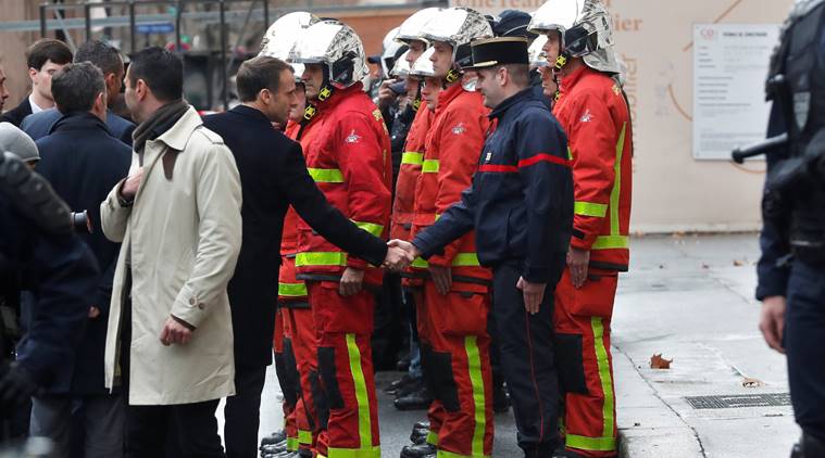 France protests: Stunned Parisians clean up posh central district after worst riots since 1968