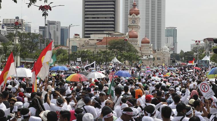 Malaysia Muslims rally, malaysia rally, protest against treaty over anti discrimination, protestors welcome govt move, world news, indian express