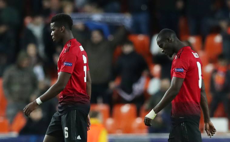 Manchester United's Paul Pogba and Eric Bailly react after the match against Valencia