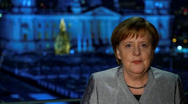 German Chancellor Angela Merkel poses for a photograph after the recording of her annual New Year's speech at the Chancellery in Berlin on Sunday. (Reuters)