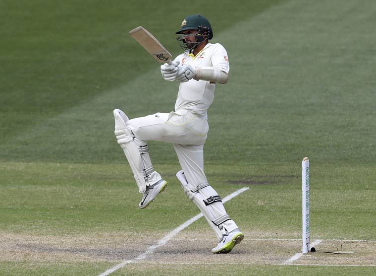 Nathan Lyon bats on the final day of the first cricket test between Australia and India in Adelaide, Australia