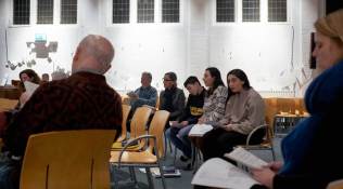 From center: Seyran, Hayarpi and Warduhi Tamrazyan, Armenian refugees whose family fled to Bethel Church to escape a deportation order, attend a continuous service in The Hague,