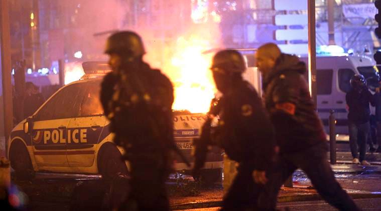 France protests: Stunned Parisians clean up posh central district after worst riots since 1968