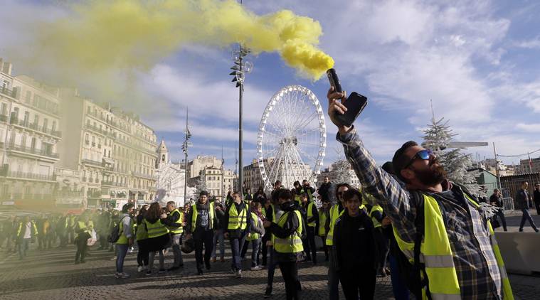 France protests: Stunned Parisians clean up posh central district after worst riots since 1968