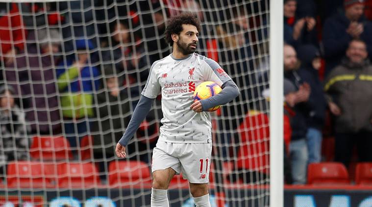 Liverpool's Mohamed Salah with the match ball at the end of the match against Bournemouth in the English Premier League