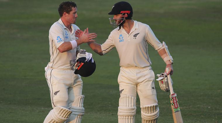 Abu Dhabi: New Zealand's batsmen, Henry Nicholls, left, and Kane Williamson shakes hands as they leave the pitch at the end of forth day in their test match against Pakistan in Abu Dhabi, United Arab Emirates, Thursday, Dec. 6, 2018. AP/PTI(AP12_6_2018_000216B)