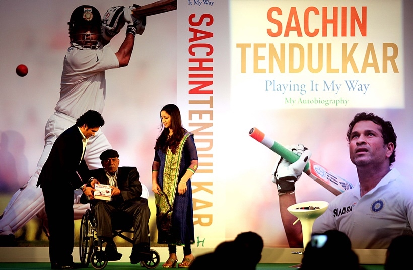 Cricketer Sachin Tendulkar with his coach Ramakant Achrekar and daughter Sara Tendulkar during the book launch of batting legend Sachin Tendulkar's autobiography 'Playing It My Way.' in Mumbai.