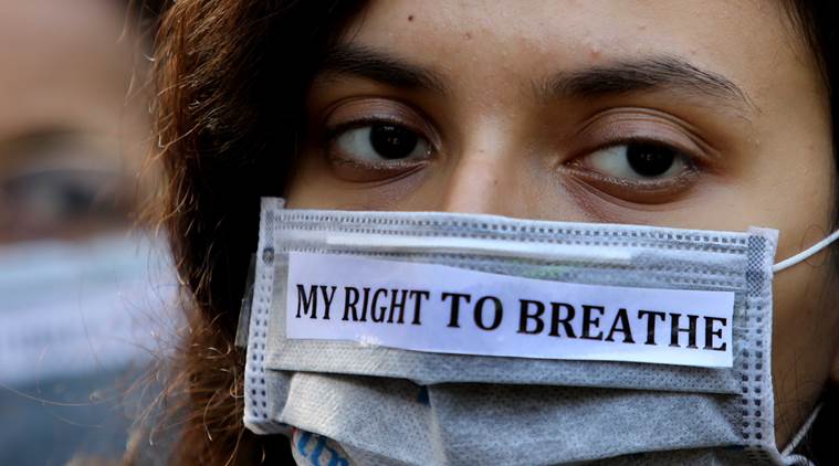 A participant at a rally in Kolkata to discuss the poor Air Quality Index in the city.
