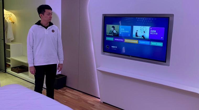 At Alibaba's futuristic hotel, robots deliver towels and mix cocktails
