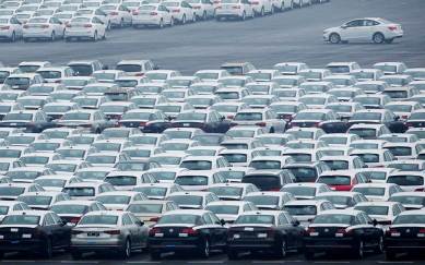 A file photo of newly manufactured cars are seen at the automobile terminal in the port of Dalian