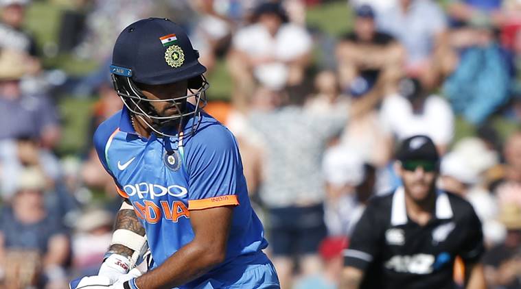 India's Shikhar Dhawan looks at his stumps after almost playing on during a one day international cricket match between New Zealand and India in Napier, New Zealand