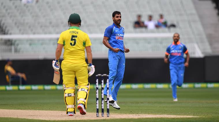 India's Bhuvneshwar Kumar, center, celebrates the wicket of Australia's Aaron Finch during their one day international cricket match in Melbourne, Australia