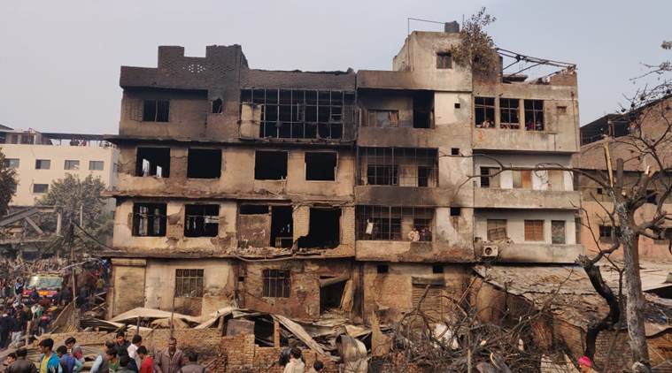 A timber godown and a few huts, housing combustible materials, were gutted in the fire. (Express photo/Renuka Puri)
