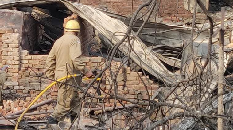 More than 30 fire engines were pressed into service after the fire erupted in Lakkar Market. (Express photo/Renuka Puri)
