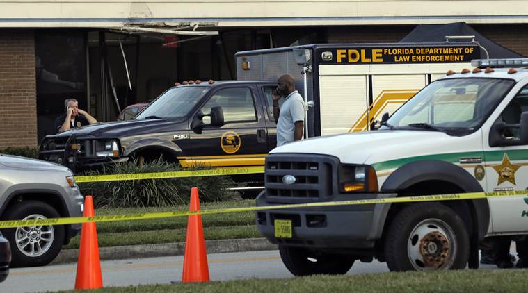 ‘I have shot five people’: 21-year-old held in massacre at Florida Bank
