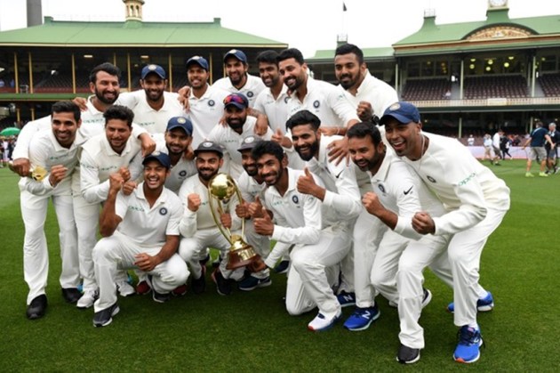 The Indian team poses for a photograph with the Border-Gavaskar Trophy as they celebrate a 2-1 series victory over Australia following play being abandoned in the fourth test match between Australia and India at the SCG in Sydney, Australia