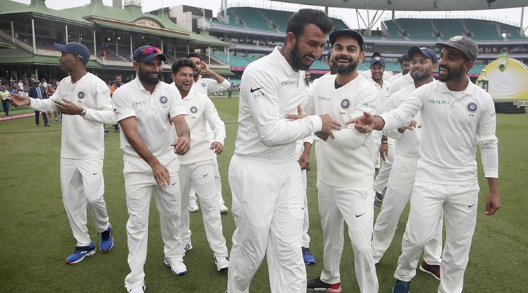 India's cricket team celebrate their series win over Australia after play was called off on day 5 of their cricket test match in Sydney