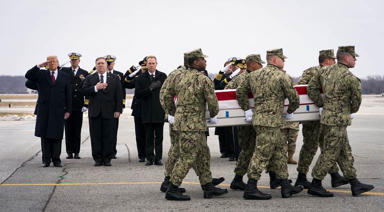 From left: President Donald Trump, Secretary of State Mike Pompeo and acting Secretary of Defense Patrick Shanahan look on as military servicemen carry the remains of Scott A. Wirtz, one of four Americans killed in a suicide bombing in Syria, at Dover Air Force Base in Delaware, on Jan. 19, 2019.
