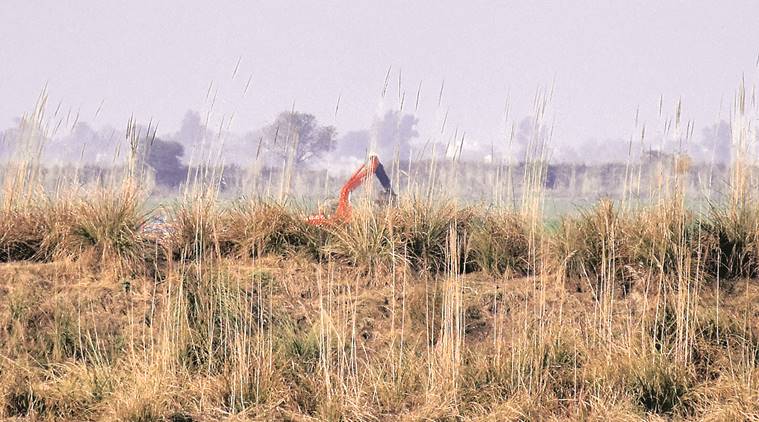 A JCB behind the defence lane of Pakistan on the border. (Express photo by Rana Simranjit Singh)