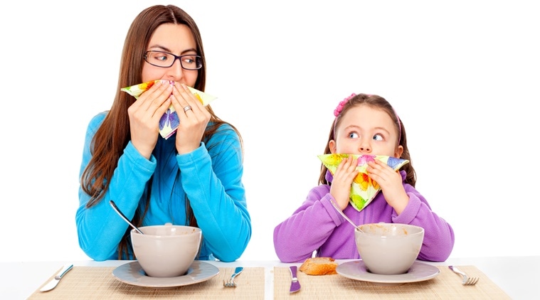 mom teaching her daughter manners