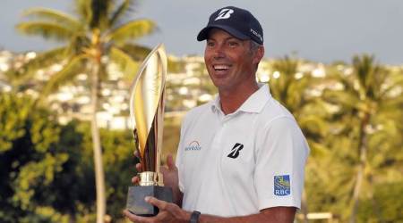 Matt Kuchar holds the champions trophy after the final round of the Sony Open PGA Tour golf event, Sunday, Jan. 13, 2019, at Waialae Country Club in Honolulu. (AP Photo) 