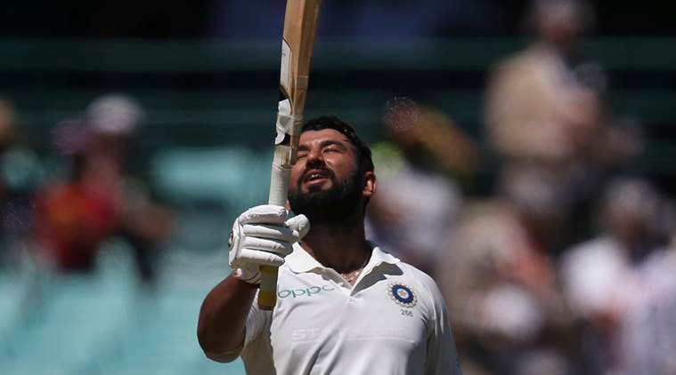 Cheteshwar Pujara celebrates making 150 runs against Australia on day 2 during their cricket test match in Sydney