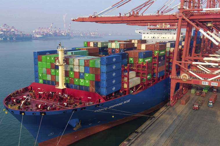 Containers are loaded on to a cargo ship
