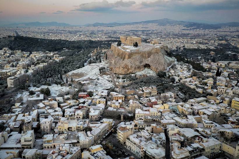 Snow coats ancient monuments in Athens amid record cold spell